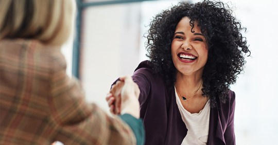 Handshake with a happy female partner