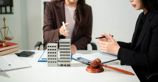 Real estate lawyer reviewing property contract