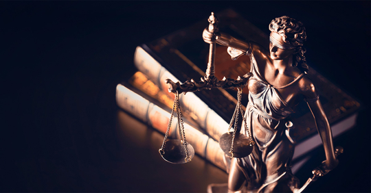 Lady Justice with books