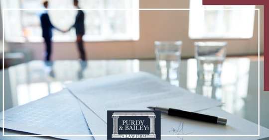Businessman writing on notepad
