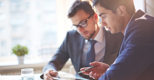 Two businessmen discussing their options about forming an LLC