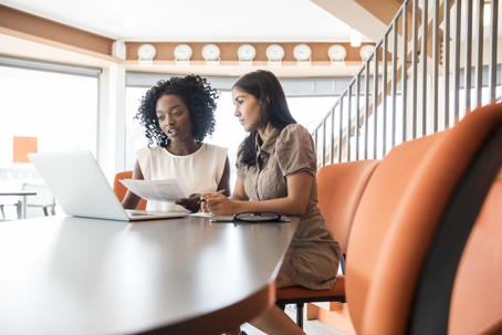 businesswomen reviewing documents
